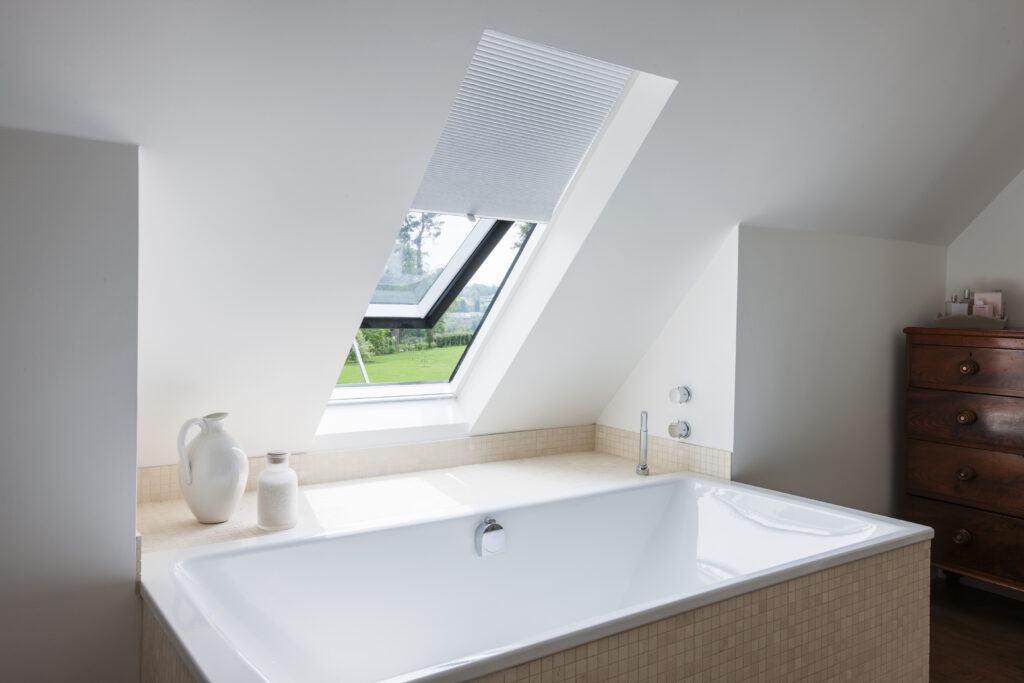 A pleated blind on a Neo Rooflight in a bathroom