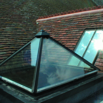 A pyramid rooflight with a conservation rooflight behind.
